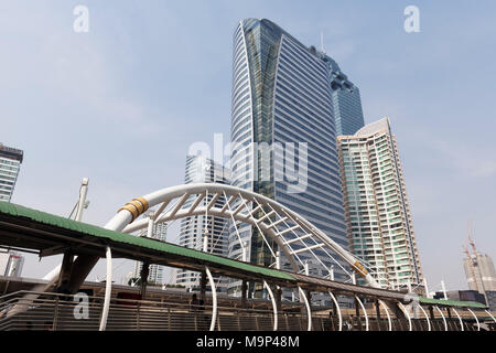 Skyscrapers in the business district Sathon, pedestrian bridge at the BTS station Chong Nonsi, crossing Sathon-Naradhiwas, Sathon, Bangkok, Thailand Stock Photo