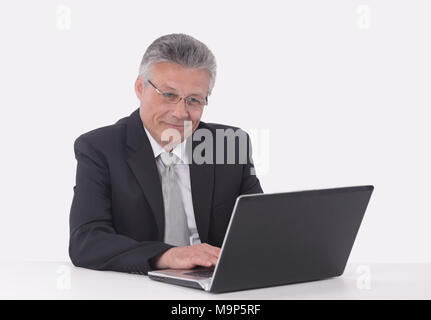 elderly businessman working on a laptop. Stock Photo
