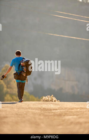 Vertical shot of a person walking around on a beach Stock Photo - Alamy