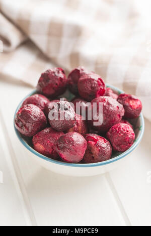 Freeze dried cherries in bowl. Stock Photo