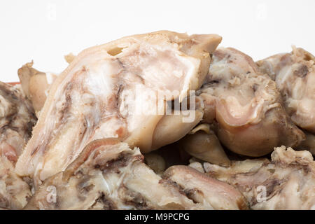 Pigs trotters that have been boiled until tender and split and left to cool before being eaten with a splash of vinegar UK. Pigs trotters are rich in Stock Photo