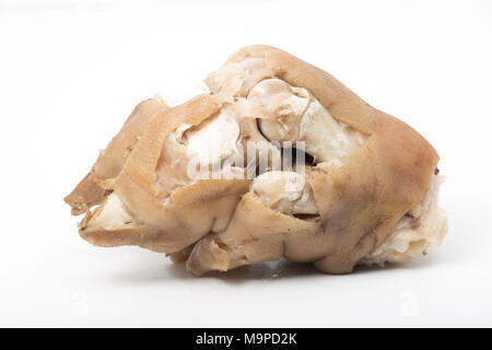 Pigs trotters that have been boiled until tender and left to cool before being eaten with a splash of vinegar UK. Pigs trotters are rich in collagen. Stock Photo