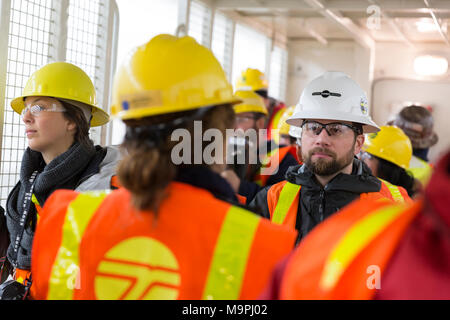Seattle, Washington, USA. 27th Mar, 2018. Members of the media gathered during a tour of the SR 99 Tunnel. The Alaskan Way Viaduct Replacement Program’s road decks have been completed and the tunnel’s operational and safety systems are currently being installed. The bored road tunnel is replacing the Alaskan Way Viaduct and will carry State Route 99 under downtown Seattle from the SODO neighborhood to South Lake Union. Credit: Paul Christian Gordon/Alamy Live News Stock Photo