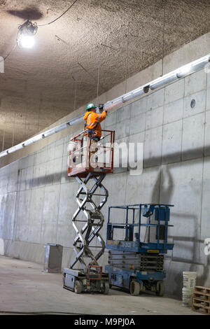 Seattle, Washington, USA. 27th Mar, 2018. Seattle Tunnel Partners' employee works on the lighting of the upper deck of the SR 99 Tunnel. The Alaskan Way Viaduct Replacement Program’s road decks have been completed and the tunnel’s operational and safety systems are currently being installed. The bored road tunnel is replacing the Alaskan Way Viaduct and will carry State Route 99 under downtown Seattle from the SODO neighborhood to South Lake Union. Credit: Paul Christian Gordon/Ģ����ý Live News Stock Photo