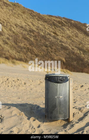 Bin on the beach to keep it clean and tidy Stock Photo