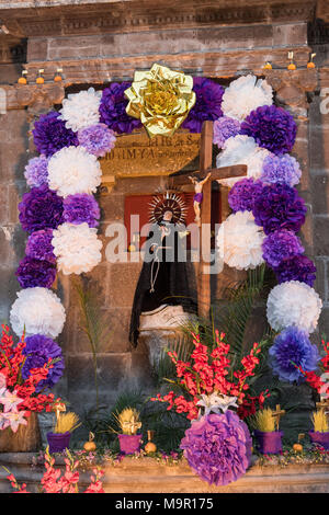 A community altar celebrating El Viernes de Dolores during Holy Week at the Aldama fountain March 23, 2018 in San Miguel de Allende, Mexico. The event honors the sorrow of the Virgin Mary for the death of her son and is an annual tradition in central Mexico. Stock Photo