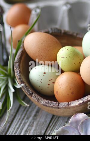 Colorful Easter eggs on wooden table Stock Photo