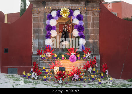 A community altar celebrating El Viernes de Dolores during Holy Week at the Aldama fountain March 23, 2018 in San Miguel de Allende, Mexico. The event honors the sorrow of the Virgin Mary for the death of her son and is an annual tradition in central Mexico. Stock Photo