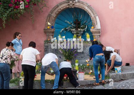 Mexican people prepare a community altar celebrating El Viernes de Dolores during Holy Week March 23, 2018 in San Miguel de Allende, Mexico. The event honors the sorrow of the Virgin Mary for the death of her son and is an annual tradition in central Mexico. Stock Photo