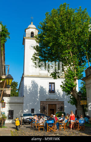 Street café in front of the church Matriz, Colonia del Sacramento, Uruguay Stock Photo