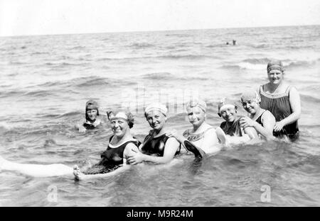 Six women bathing in the sea, 1930s, Germany Stock Photo
