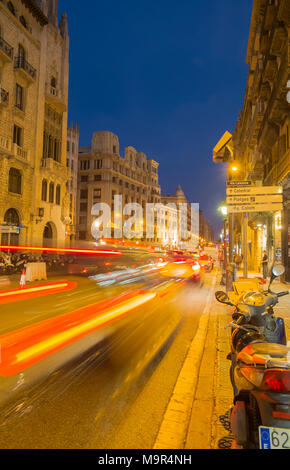 Vehicles speed down Via Laietana at night, in Barcelona, Spain Stock Photo
