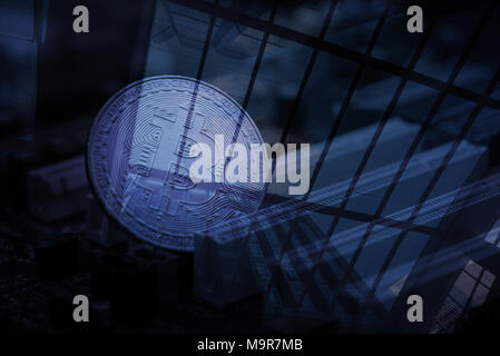 Double exposure bitcoin digital currency, bit-coin on motherboard or with chips on city background, Cryptocurrency money concept idea. Stock Photo