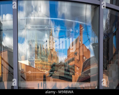 ST PANCRAS STATION AND BRITISH LIBRARY: reflection of these distinctive building in a nearby window Stock Photo