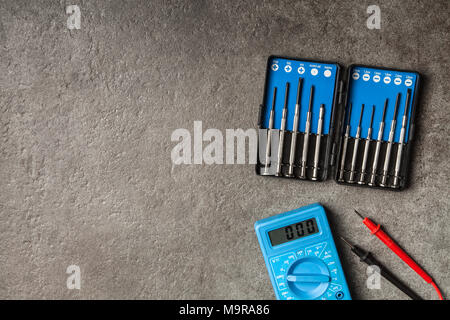 Digital multimeter on grey background Stock Photo