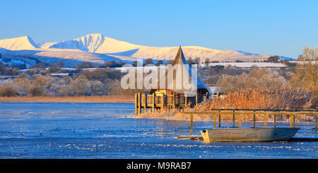 Llangorse Lake Brecon Beacons Powys Wales in winter with Pen y Fan & Corn Du mountains Stock Photo