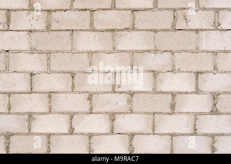 Background texture of concrete block wall in construction site. Stock Photo