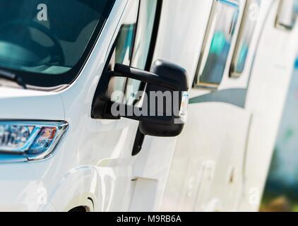 Camper Van Vacation Trip. Modern Compact Size Motorhome Side Closeup. RV Industry Theme. Stock Photo