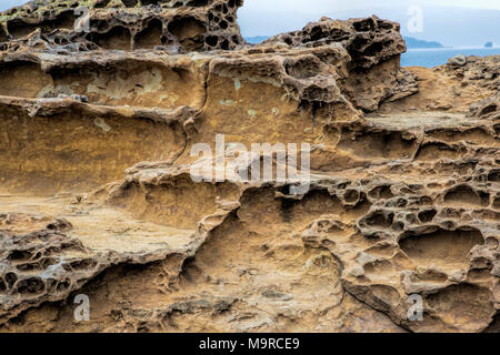 Honeycomb weathering patterns in the limestone within the Yehliu Geological Park known to geologists as the Yehliu Promontory, forms part of the Dalia Stock Photo