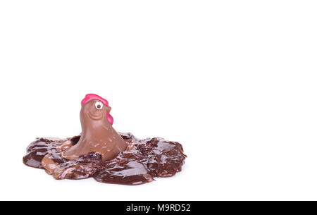 Melting chocolate easter chicken - Isolated on white background Stock Photo