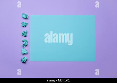 Two tone blue and purple color paper background with crumpled paper balls. Empty page for text, design, advertising. Stock Photo