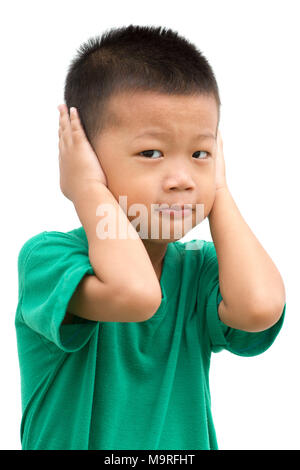 Asian child covering his ears. Portrait of young boy isolated on white background. Stock Photo