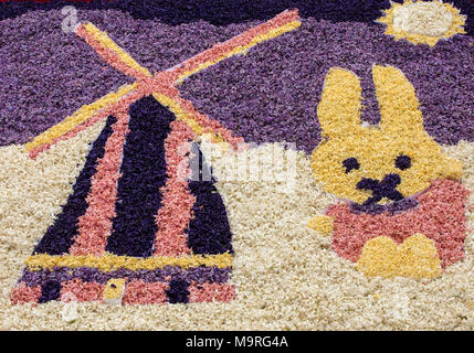 Noordwijkerhout, Netherlands - April 23,  2017: Traditional windmill and Easter rabbit made of hyacinths at the traditional flowers parade Bloemencors Stock Photo