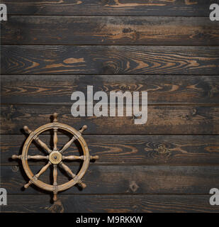 steering wheel on dark wood background Stock Photo