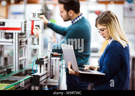 Young students of electronics working on project Stock Photo