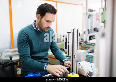 Young student of electronics working on project Stock Photo