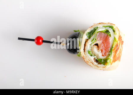 Pancake with salmon and salad leves roll Stock Photo