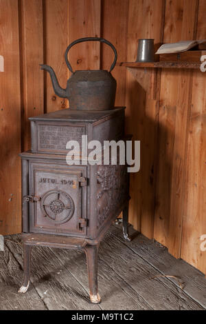 Vintage, antique, wood burning stove with kettle, American yesteryear memorabilia, UK Stock Photo