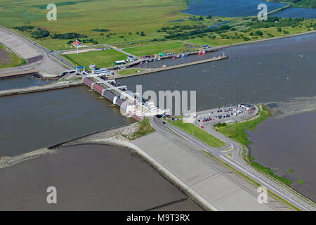 Aerial view over the Eider Barrage / Eidersperrwerk at the mouth of the river Eider near Tönning on Germany’s North Sea coast, Schleswig-Holstein, Ger Stock Photo