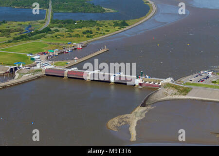 Aerial view over the Eider Barrage / Eidersperrwerk at the mouth of the river Eider near Tönning on Germany’s North Sea coast, Schleswig-Holstein, Ger Stock Photo