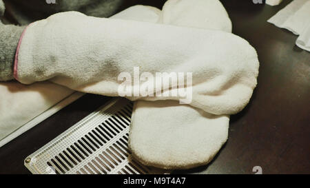 Process paraffin treatment of female hands in beauty salon. Stock Photo