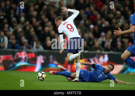 Jamie Vardy of England is tackled by Mattia De Sciglio of Italy. Football International friendly, England v Italy at Wembley Stadium in London on Tues Stock Photo