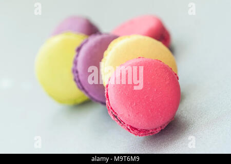 Several colorful macaroons, french sweet delicacy close-up Stock Photo