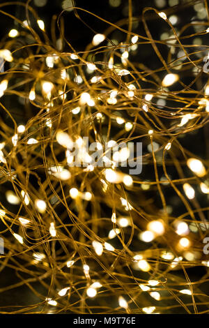 Cluster of micro LED string lights. Shallow depth of field, out of focus blurred. Stock Photo