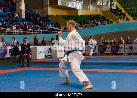 Lviv , Ukraine - March 25, 2018: International open karate cup . Unknown athlete performs during the competition  in the sports complex of the army,   Stock Photo