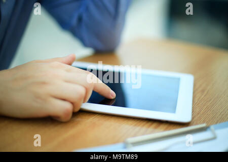 close up hands multitasking man using tablet, laptop connecting wifi Stock Photo