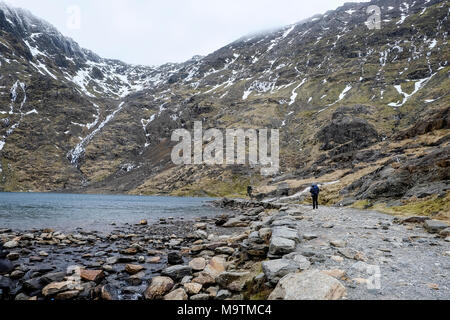 Walker on the Miners Path which leads to the summit of Mount Snowdon, Snowdonia, Gwynedd, North Wales, UK Stock Photo