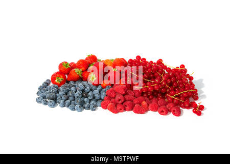 Berry fruits like strawberries, blueberries, red currants and raspberries in a bunch. Stock Photo