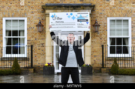 Father of three and life-long Leyton Orient fan from Wickford, Paul Long, celebrates after his Lucky Dip ticket matched all six numbers to scoop the &pound;9,339,858 Lotto Jackpot on Saturday 24 March, at the Orsett Hall Hotel, in Orsett, Essex. Stock Photo