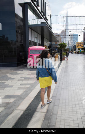 Rear view ofa woman walking in citywalk Dubai UAE Stock Photo