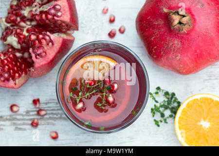 Fresh pomegranate juice with orange and lemon thyme, healthy drinks Stock Photo