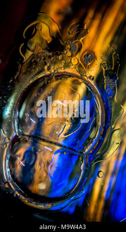 Psychedelic colours bubbles over coloured glass. Stock Photo