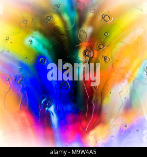 Psychedelic colours bubbles over coloured glass. Stock Photo