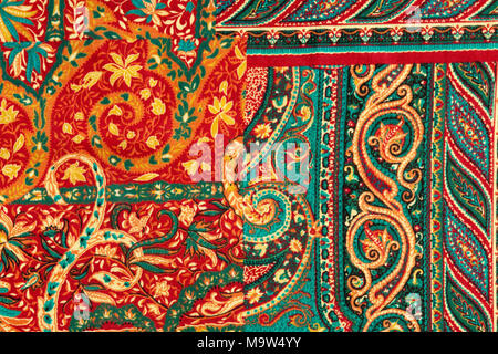 Detail shot of a piece of fabric with a vibrant abstract Paisley pattern - a floral design with scrolls Stock Photo
