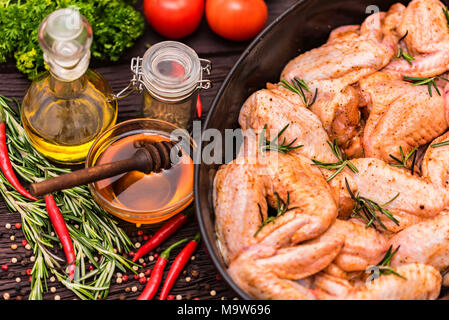 Chickens wings covered in honey, vegetables Stock Photo