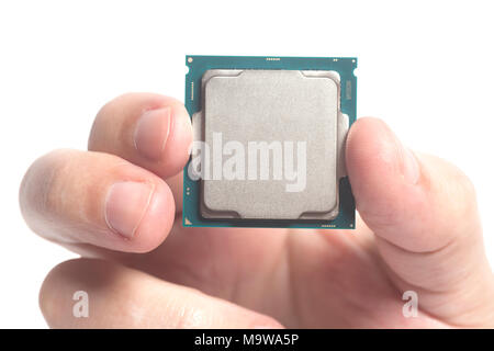 Central processing unit CPU microchip male hand holding isolated on white Stock Photo